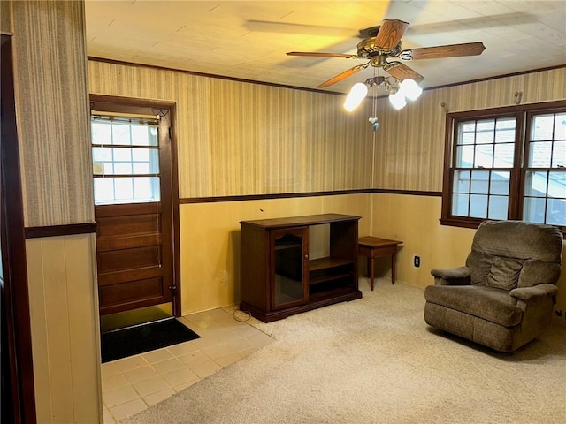 8 Noyes Ct, Mattoon, IL 61938 - sitting room with wainscoting, wallpapered walls, a ceiling fan, ornamental molding, and wooden walls