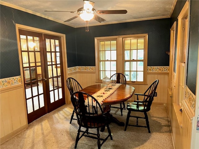 8 Noyes Ct, Mattoon, IL 61938 - dining area featuring french doors, wainscoting, carpet floors, ceiling fan, and crown molding