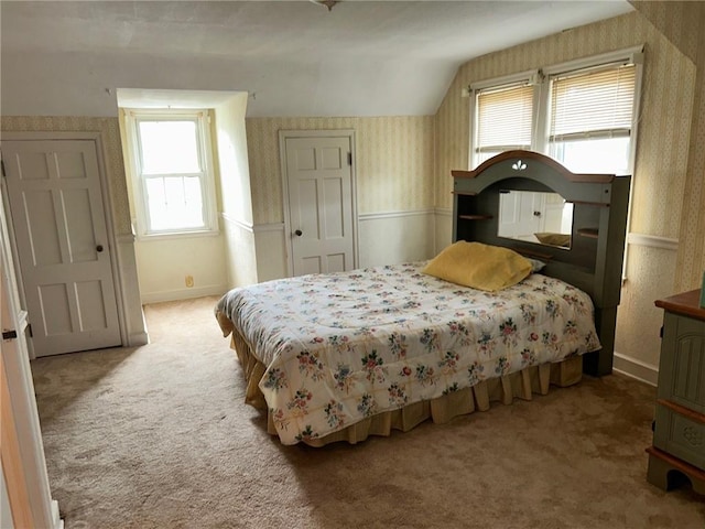 8 Noyes Ct, Mattoon, IL 61938 - bedroom with wallpapered walls, carpet floors, vaulted ceiling, and multiple windows
