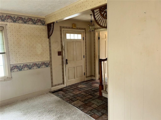 8 Noyes Ct, Mattoon, IL 61938 - entryway featuring ornamental molding, brick patterned floors, wallpapered walls, and a textured ceiling