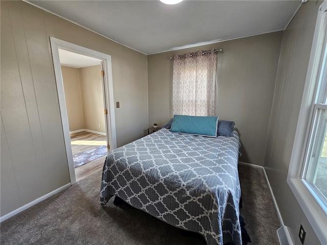 bedroom featuring baseboards and carpet floors