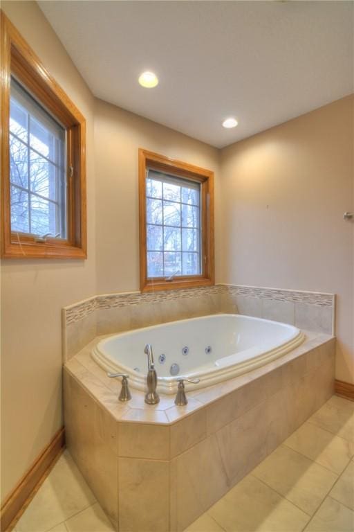 bathroom featuring a jetted tub, recessed lighting, tile patterned flooring, and baseboards