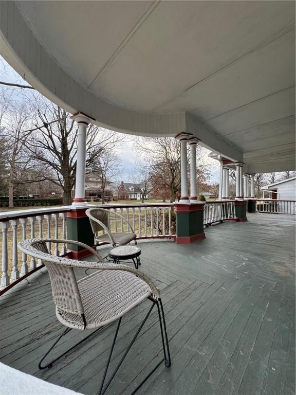 wooden deck featuring covered porch