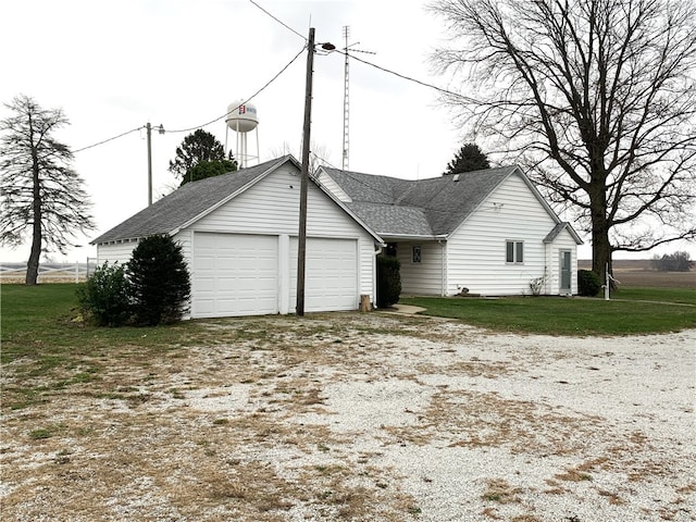 exterior space with a front lawn and a garage