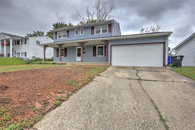 view of front of home featuring a porch and a garage