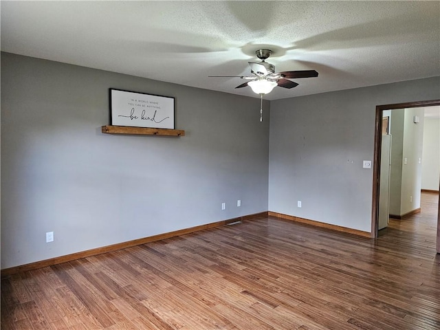 504 W Walnut St, Teutopolis, IL 62467 - spare room with ceiling fan and wood finished floors