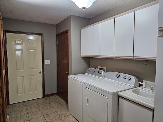 504 W Walnut St, Teutopolis, IL 62467 - laundry area with cabinet space, washer and dryer, and light tile patterned flooring