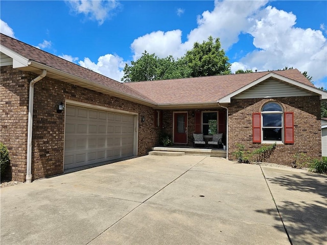 504 W Walnut St, Teutopolis, IL 62467 - ranch-style home with driveway, brick siding, and covered porch