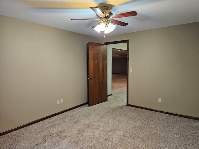 504 W Walnut St, Teutopolis, IL 62467 - unfurnished room with light colored carpet and ceiling fan