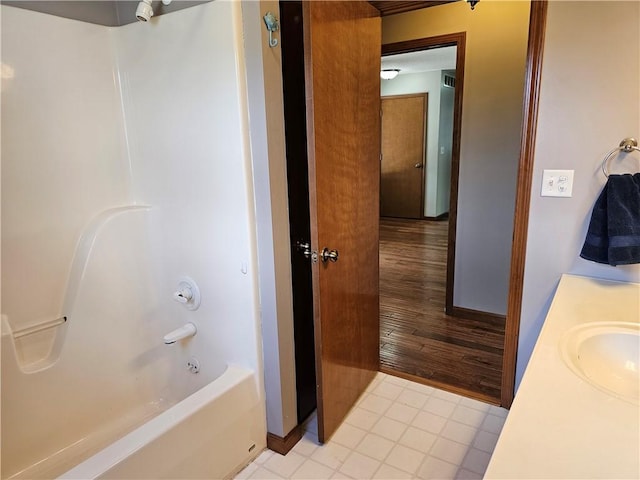 504 W Walnut St, Teutopolis, IL 62467 - bathroom featuring vanity, shower / tub combination, and wood finished floors