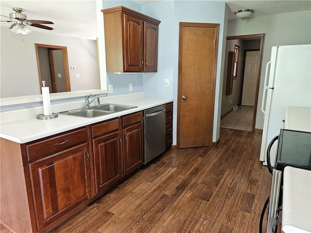 504 W Walnut St, Teutopolis, IL 62467 - kitchen featuring dishwasher, freestanding refrigerator, range, a ceiling fan, and dark wood finished floors