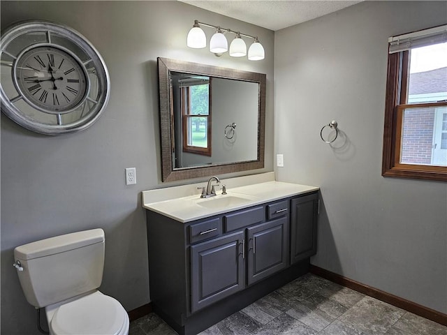 504 W Walnut St, Teutopolis, IL 62467 - bathroom featuring plenty of natural light, vanity, and a textured ceiling