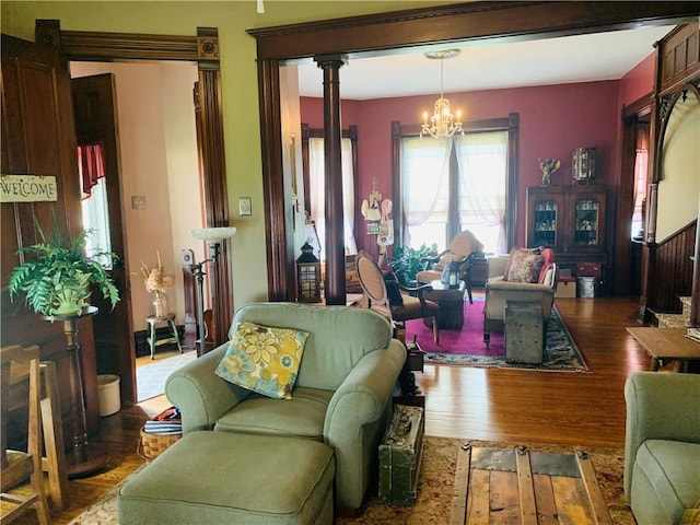 living room featuring wood finished floors and a notable chandelier