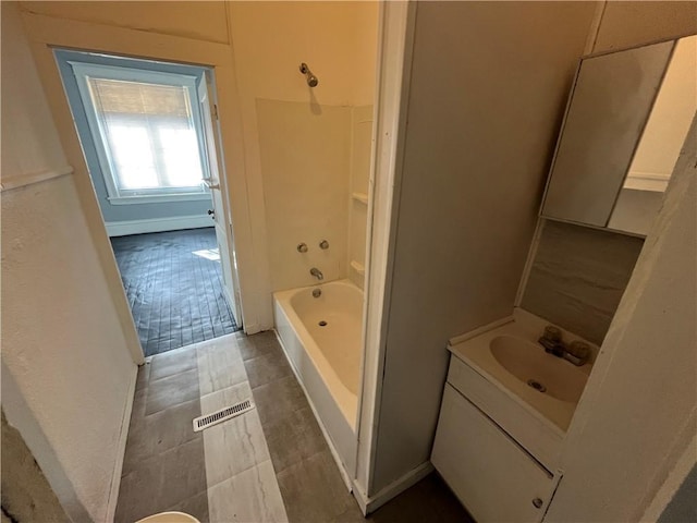 bathroom with vanity and bathing tub / shower combination