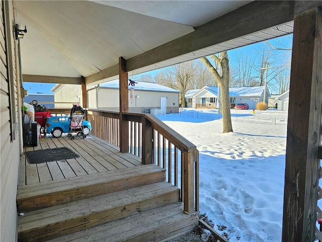 view of snow covered deck