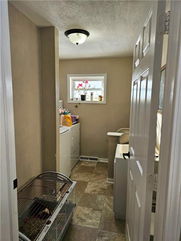 washroom with separate washer and dryer