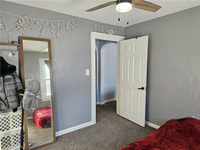 carpeted bedroom with ceiling fan