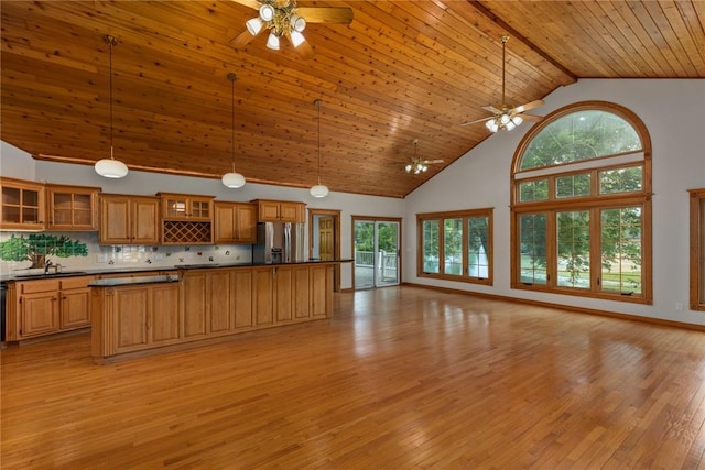 11311 E Thistlewood Ln, Effingham, IL 62401 - kitchen with ceiling fan, stainless steel fridge with ice dispenser, open floor plan, high vaulted ceiling, and dark countertops