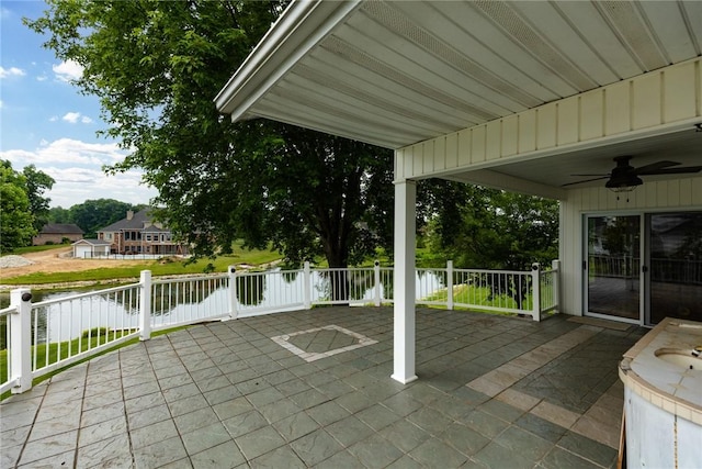 11311 E Thistlewood Ln, Effingham, IL 62401 - view of patio with ceiling fan and a water view