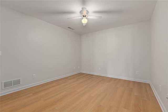 11311 E Thistlewood Ln, Effingham, IL 62401 - spare room with a ceiling fan and light wood-style floors