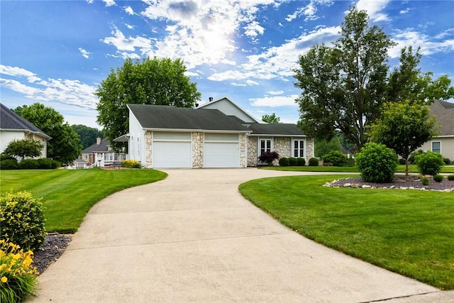 11311 E Thistlewood Ln, Effingham, IL 62401 - view of front of home with stone siding, driveway, an attached garage, and a front lawn