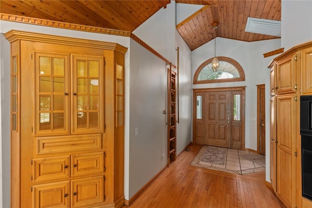 11311 E Thistlewood Ln, Effingham, IL 62401 - foyer entrance featuring light wood-style flooring, wood ceiling, a chandelier, and high vaulted ceiling