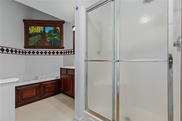 11311 E Thistlewood Ln, Effingham, IL 62401 - full bath with a shower stall, a bath, vanity, tile walls, and vaulted ceiling