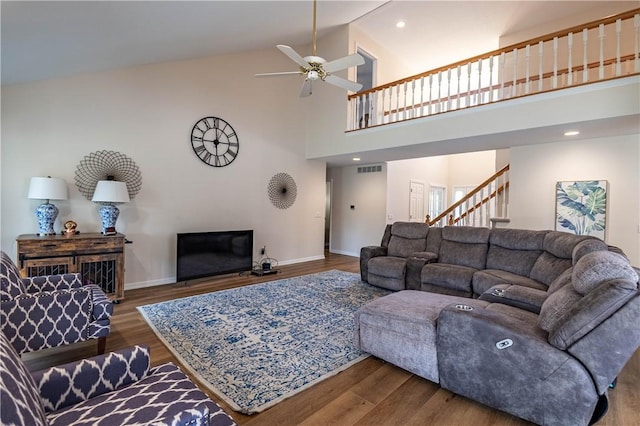 1117 Wedgewood Ct, Decatur, IL 62526 - living room with high vaulted ceiling, ceiling fan, wood finished floors, and stairs