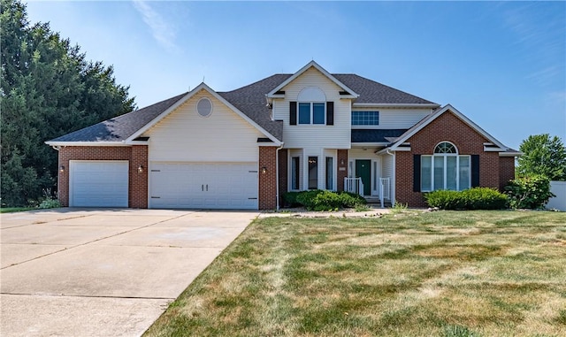 1117 Wedgewood Ct, Decatur, IL 62526 - traditional-style home with an attached garage, brick siding, concrete driveway, and a front yard