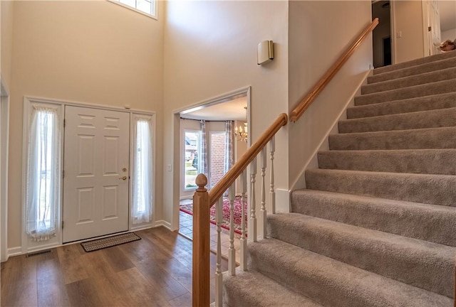 1117 Wedgewood Ct, Decatur, IL 62526 - foyer featuring stairway, wood finished floors, healthy amount of natural light, and a high ceiling