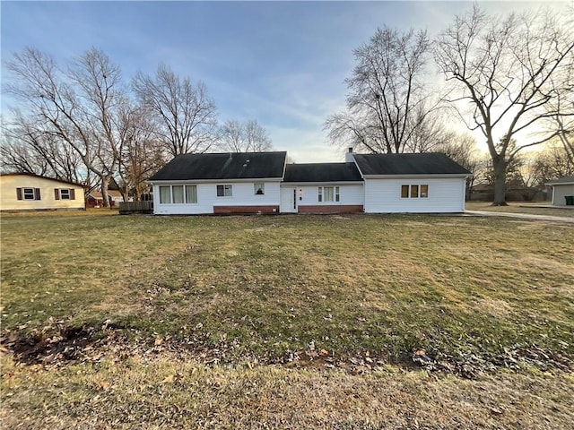 view of front of property with a yard