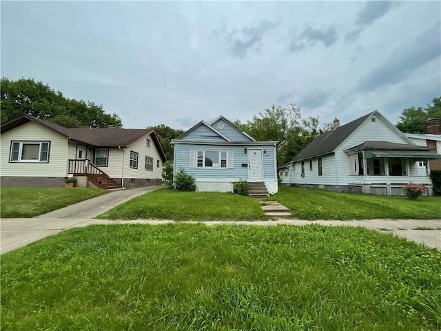 bungalow-style house with a front yard