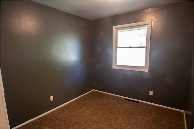 unfurnished room with carpet floors