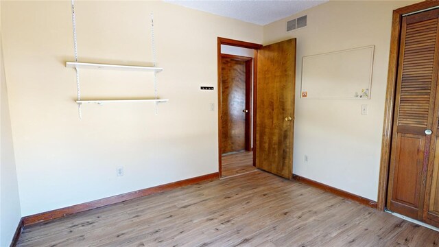 unfurnished bedroom featuring light hardwood / wood-style flooring