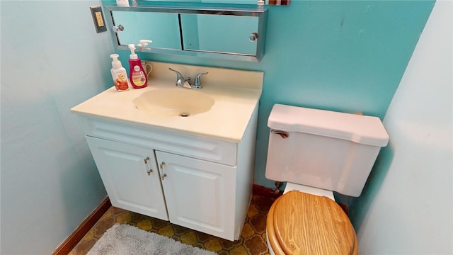 bathroom with toilet and vanity