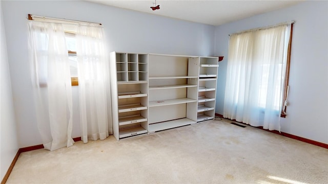 unfurnished bedroom with light carpet