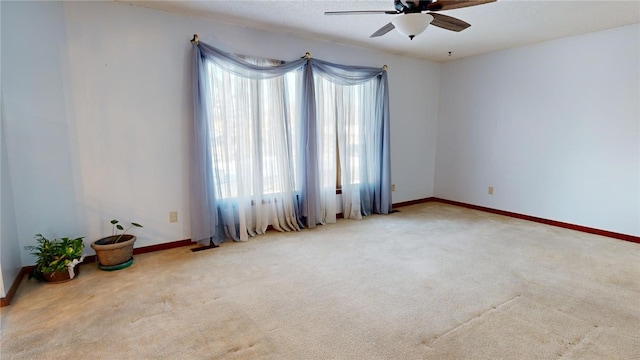 empty room with carpet and ceiling fan