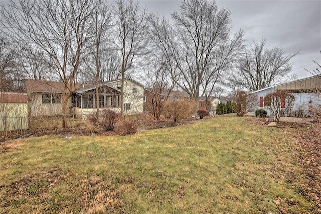 view of yard featuring a sunroom