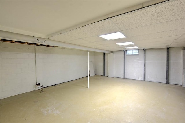 basement featuring a drop ceiling