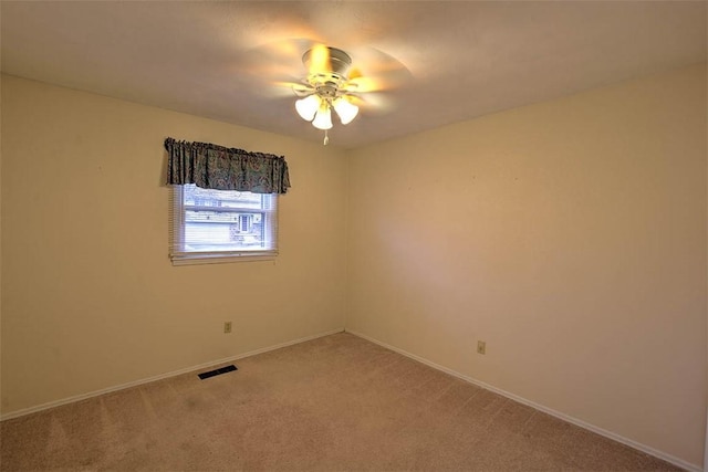 carpeted empty room with ceiling fan