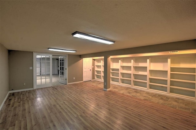 interior space with hardwood / wood-style floors and a textured ceiling