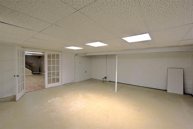 basement featuring a paneled ceiling