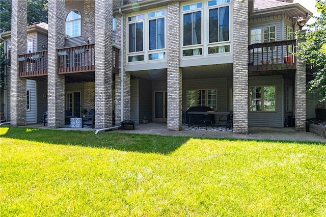1250 W Hickory Point Rd, Decatur, IL 62526 - back of house with a patio and a yard