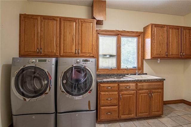 1250 W Hickory Point Rd, Decatur, IL 62526 - laundry area with cabinet space, separate washer and dryer, and light tile patterned floors