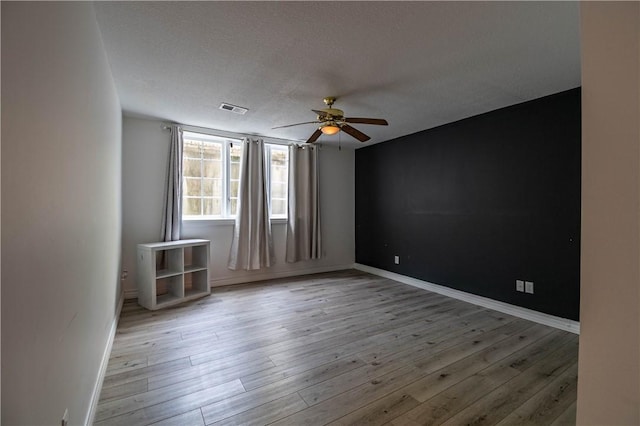 1250 W Hickory Point Rd, Decatur, IL 62526 - empty room featuring ceiling fan and wood finished floors