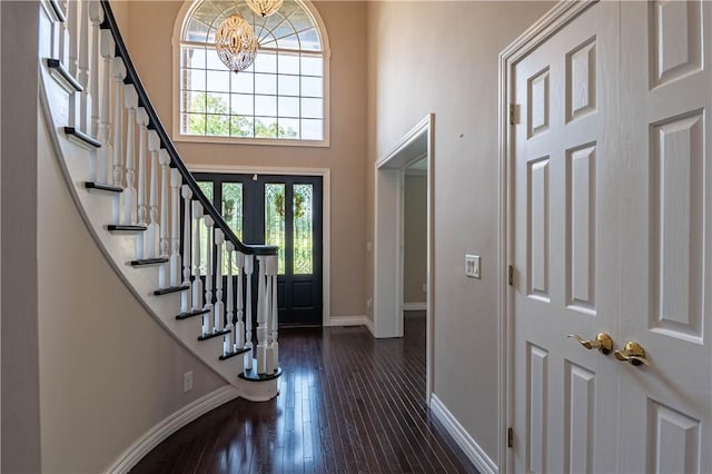 1250 W Hickory Point Rd, Decatur, IL 62526 - foyer with a chandelier, stairway, dark wood finished floors, and a high ceiling