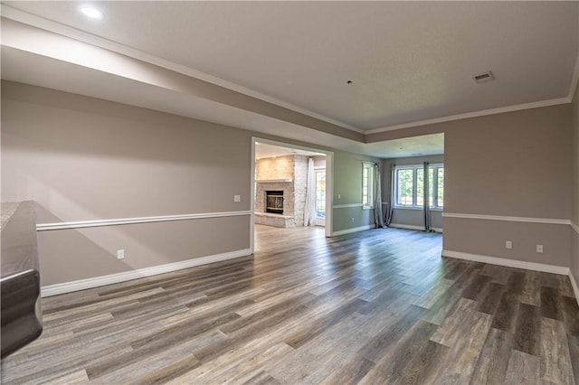1250 W Hickory Point Rd, Decatur, IL 62526 - unfurnished room featuring wood finished floors, crown molding, a fireplace, and recessed lighting