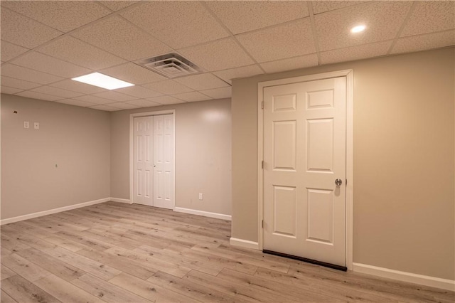 1250 W Hickory Point Rd, Decatur, IL 62526 - finished below grade area with light wood-style flooring and a drop ceiling