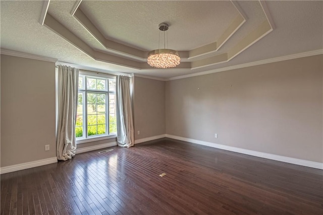 1250 W Hickory Point Rd, Decatur, IL 62526 - unfurnished room with a raised ceiling, a chandelier, dark wood-type flooring, and a textured ceiling