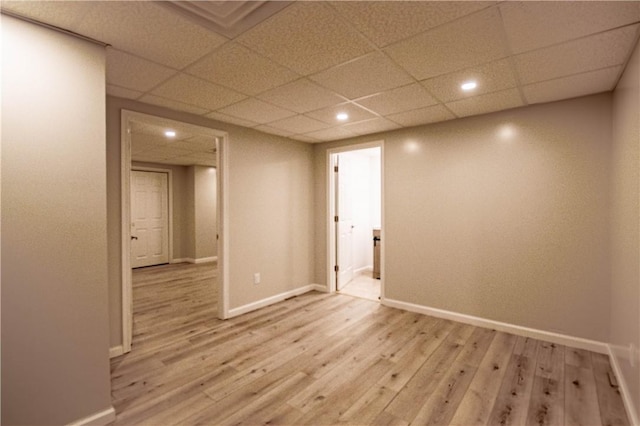 1250 W Hickory Point Rd, Decatur, IL 62526 - empty room featuring light wood-style flooring, recessed lighting, and a drop ceiling